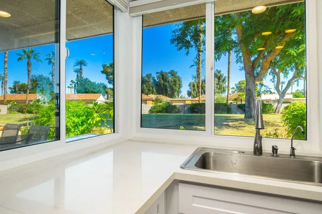 a view of a sink and a window