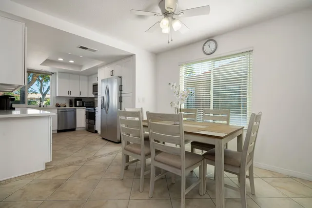 a kitchen with a table and chairs in it
