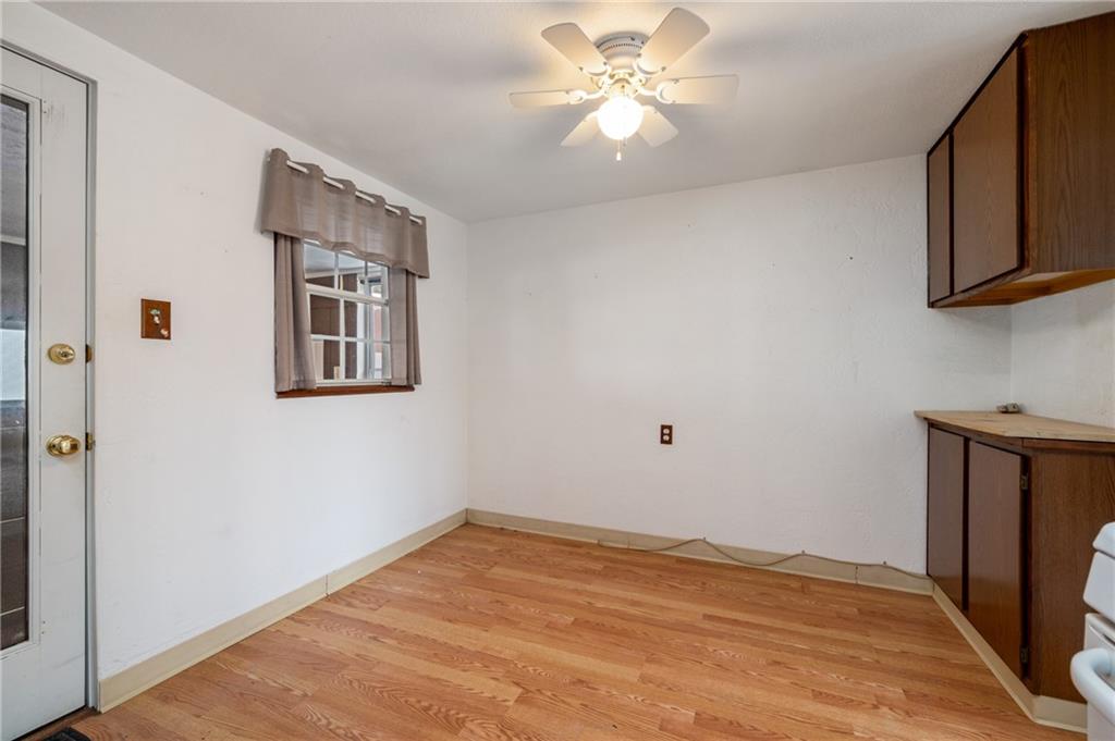 3504 Bevan Road North Versailles, PA 15137 - Photo 16 of 21 a view of empty room with wooden floor and fan