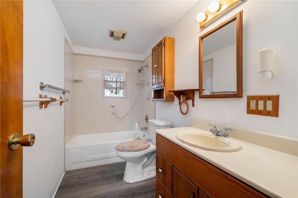 3504 Bevan Road North Versailles, PA 15137 - Photo 7 of 21 a bathroom with a granite countertop sink toilet and shower