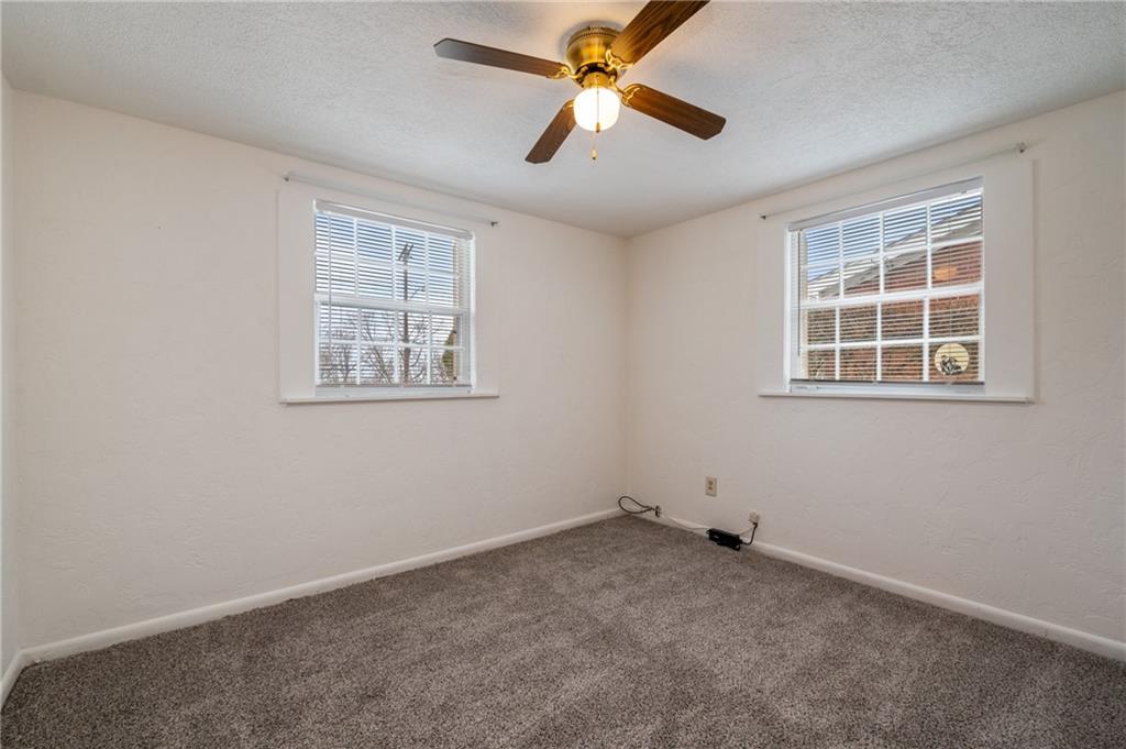 3504 Bevan Road North Versailles, PA 15137 - Photo 10 of 21 an empty room with windows and fan
