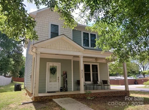 a front view of a house with a porch