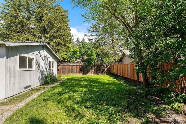 a backyard of a house with lots of green space