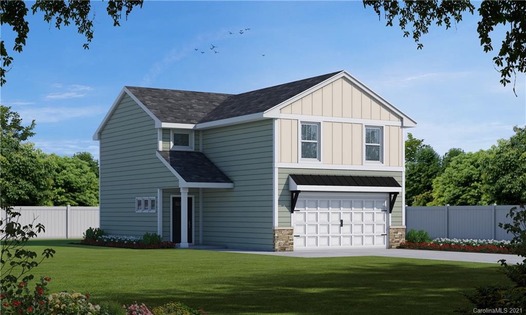 4916 Rockwood Road Charlotte, NC 28216 - Photo 1 of 1 a front view of a house with a garden