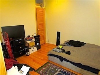 10 Moreland Street, Unit 2 Boston, MA 02119 - Photo 11 of 15 a room with furniture and air hockey table