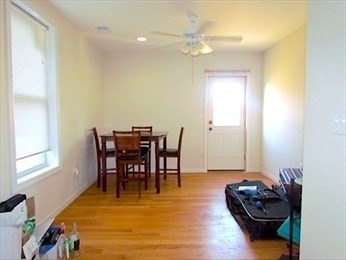 10 Moreland Street, Unit 2 Boston, MA 02119 - Photo 4 of 15 a living room with furniture and a dining table