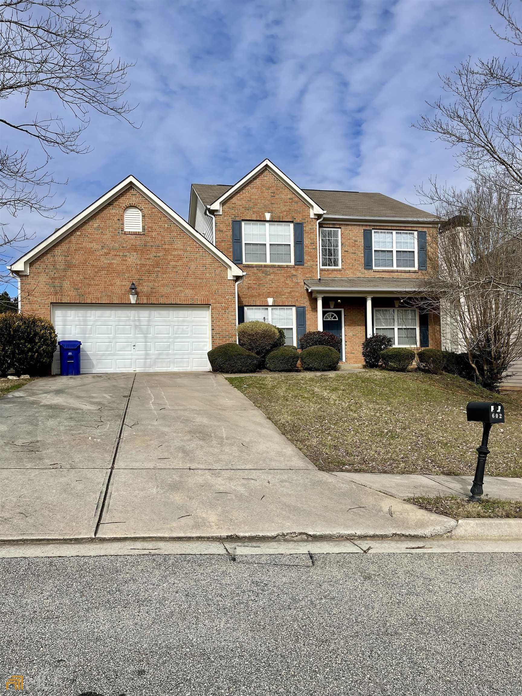 a view of multiple houses with city street
