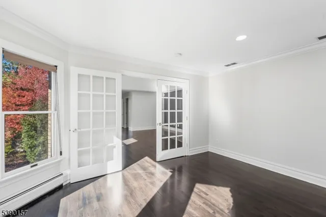 a bathroom with a granite countertop sink a toilet and shower
