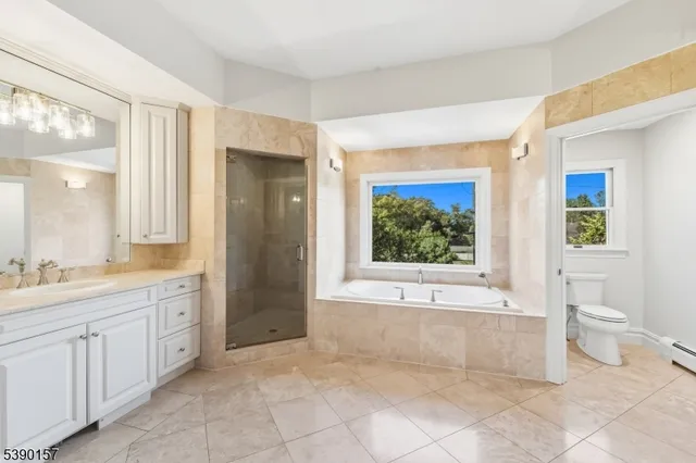an empty room with wooden floor and window