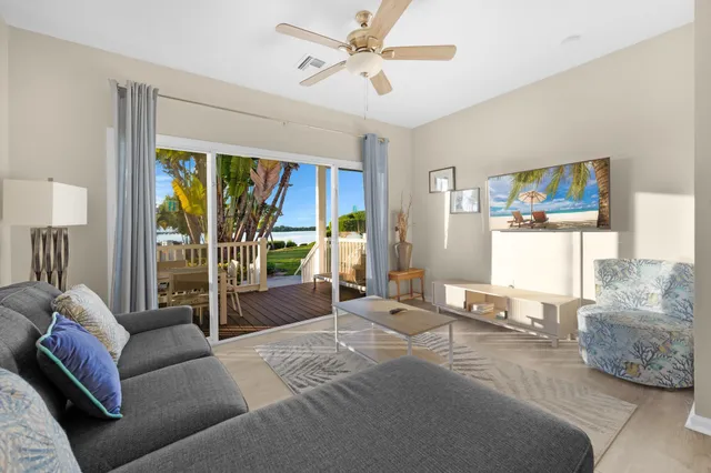 a bedroom with furniture and a large window