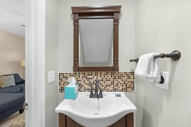 a bathroom with a sink and mirror