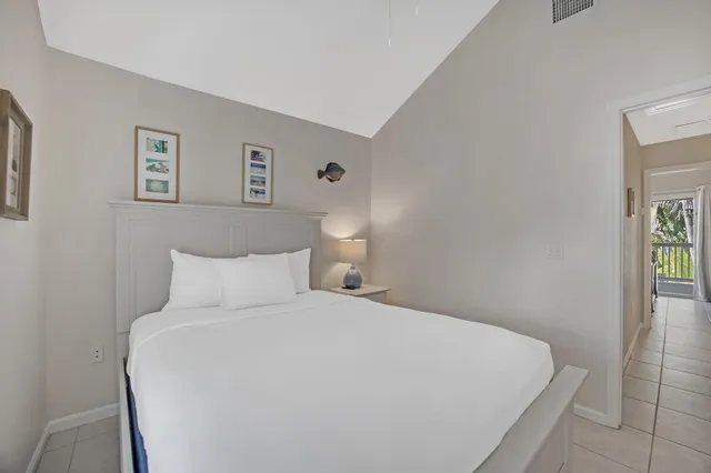 a view of a balcony with wooden floor and fence