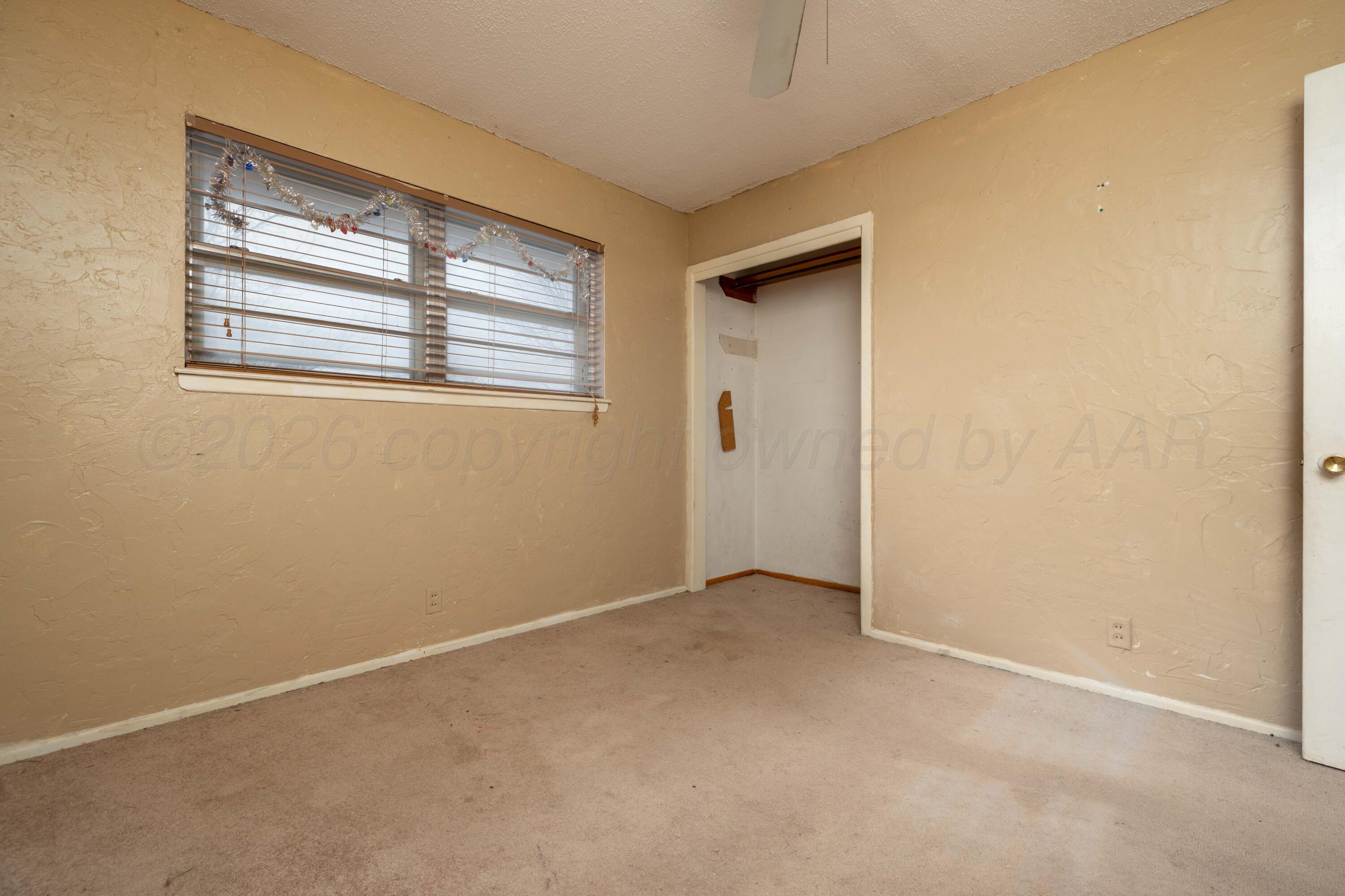 712 West Oak Street Dimmitt, TX 79027 - Photo 12 of 19 an empty room with windows