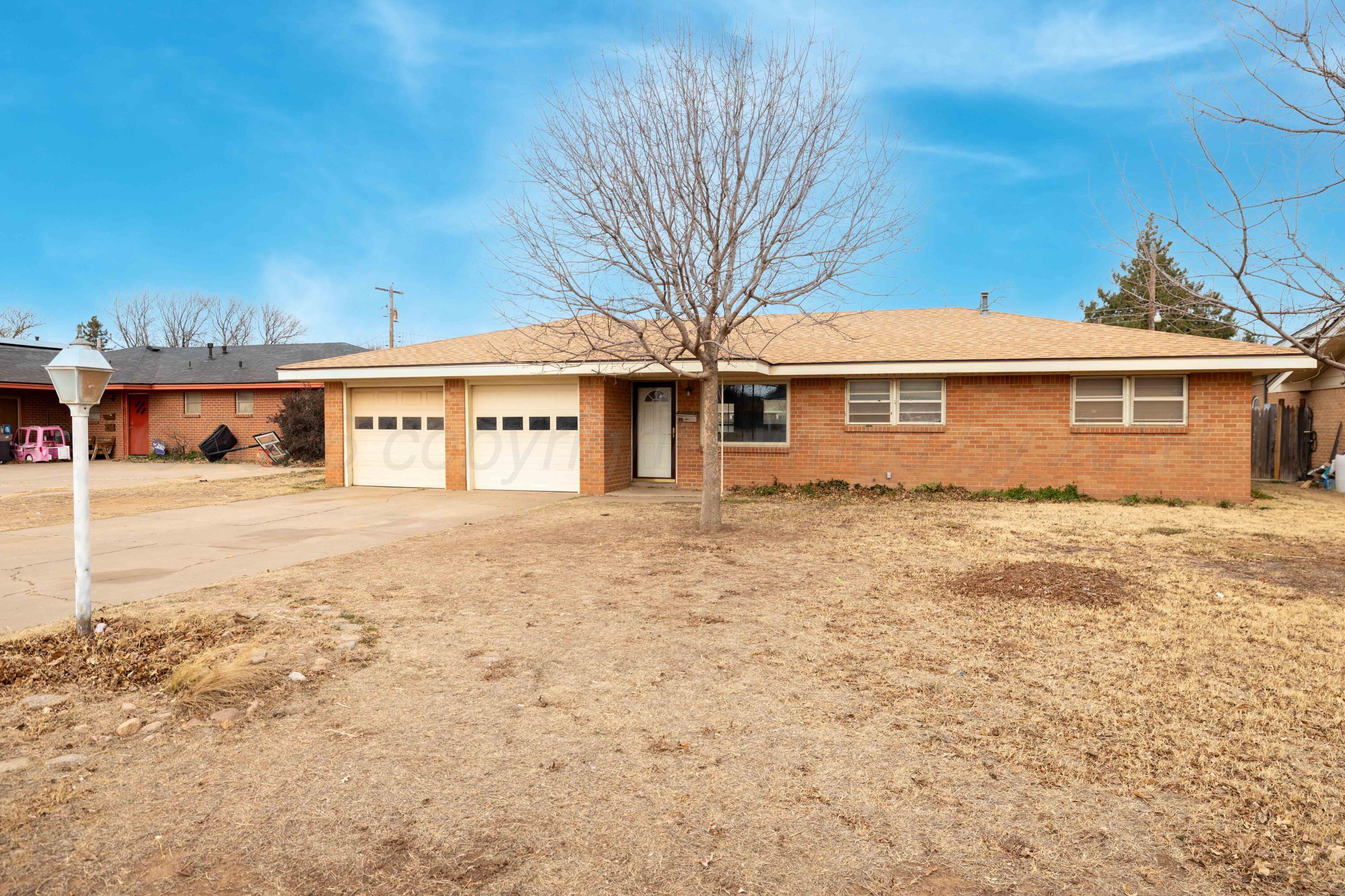 712 West Oak Street Dimmitt, TX 79027 - Photo 19 of 19 a front view of a house with a yard