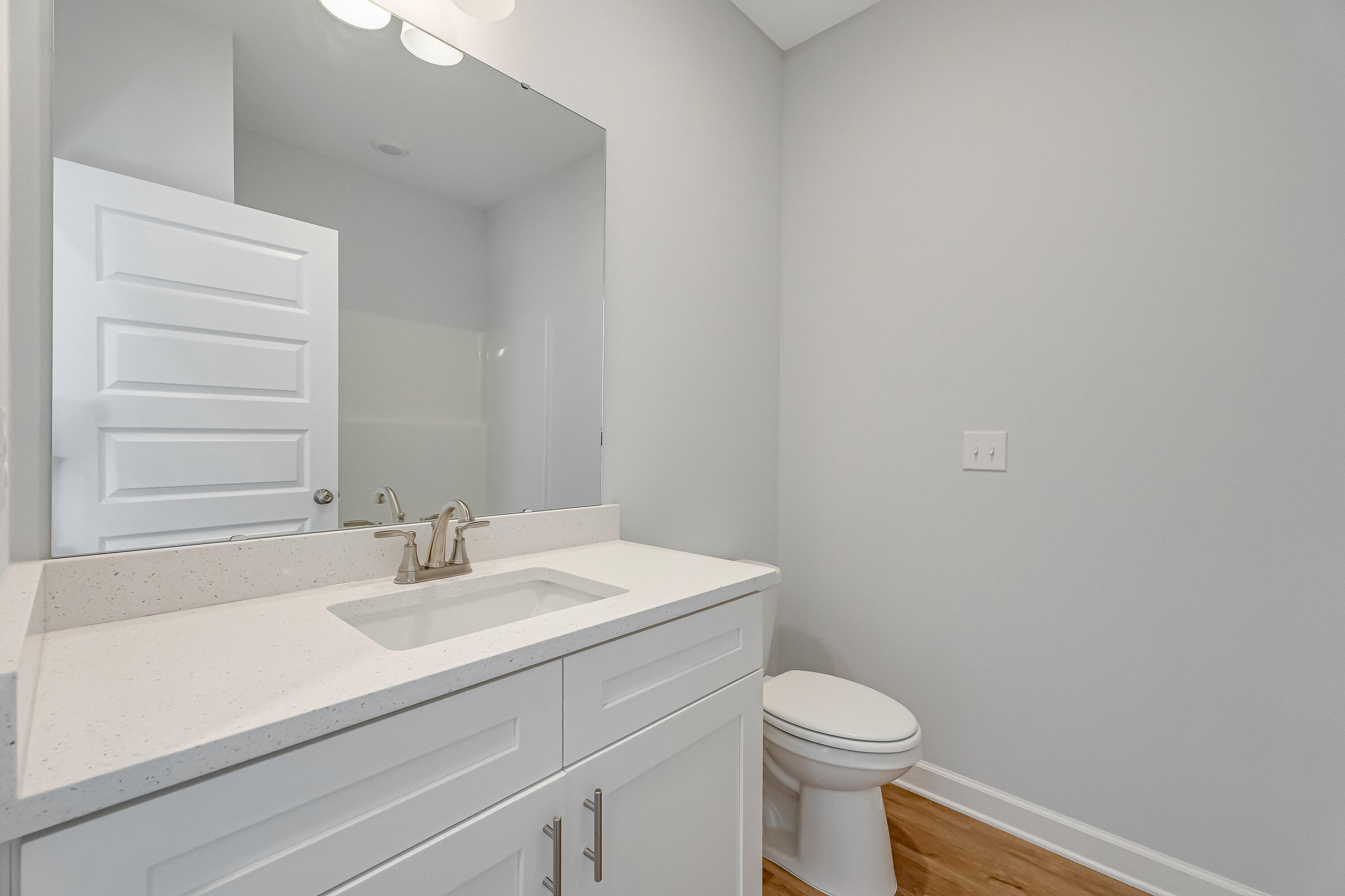 47 Shebbi Lane Freeport, FL 32439 - Photo 14 of 24 a bathroom with a sink a toilet and a mirror