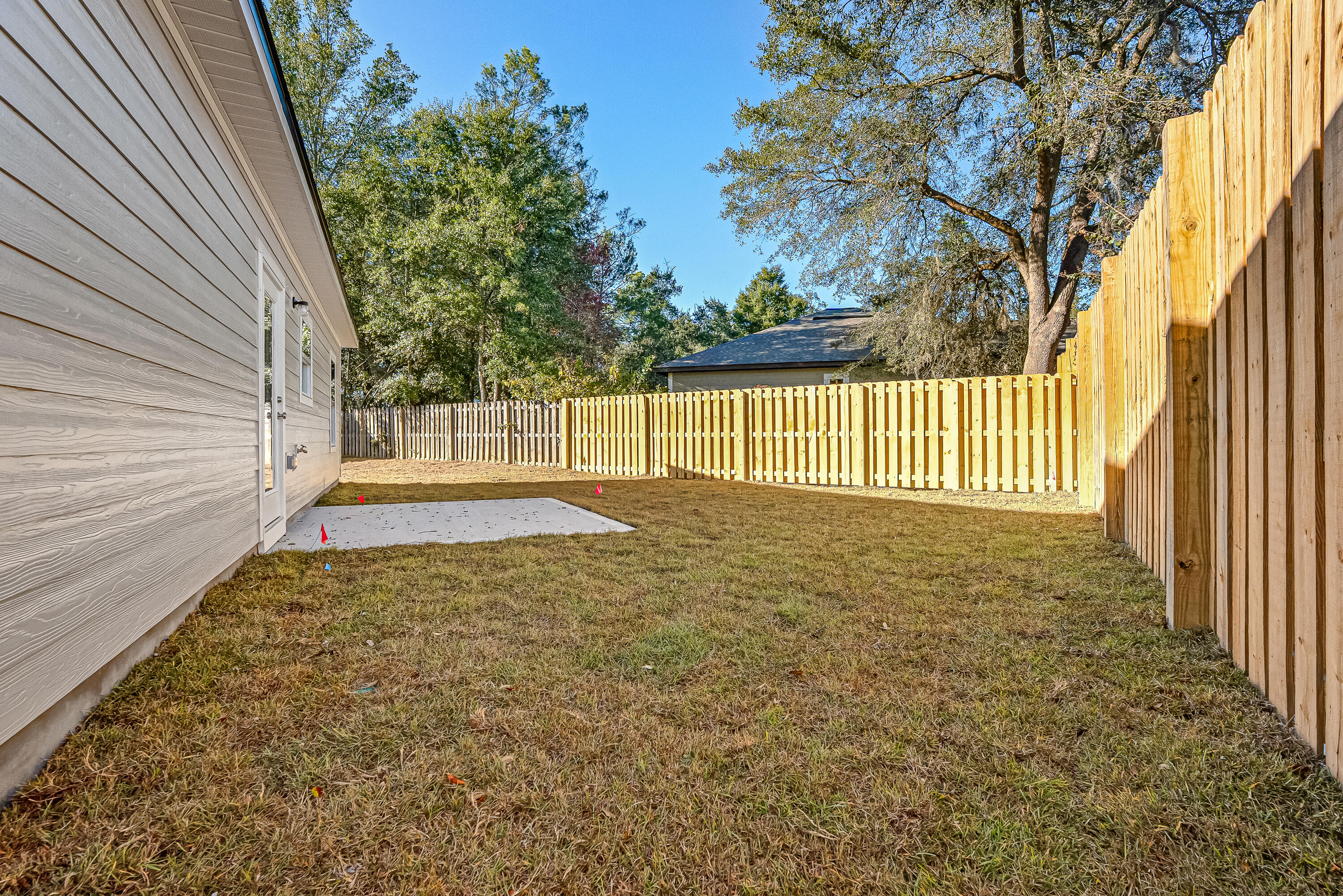 47 Shebbi Lane Freeport, FL 32439 - Photo 21 of 24 a view of a yard with wooden fence
