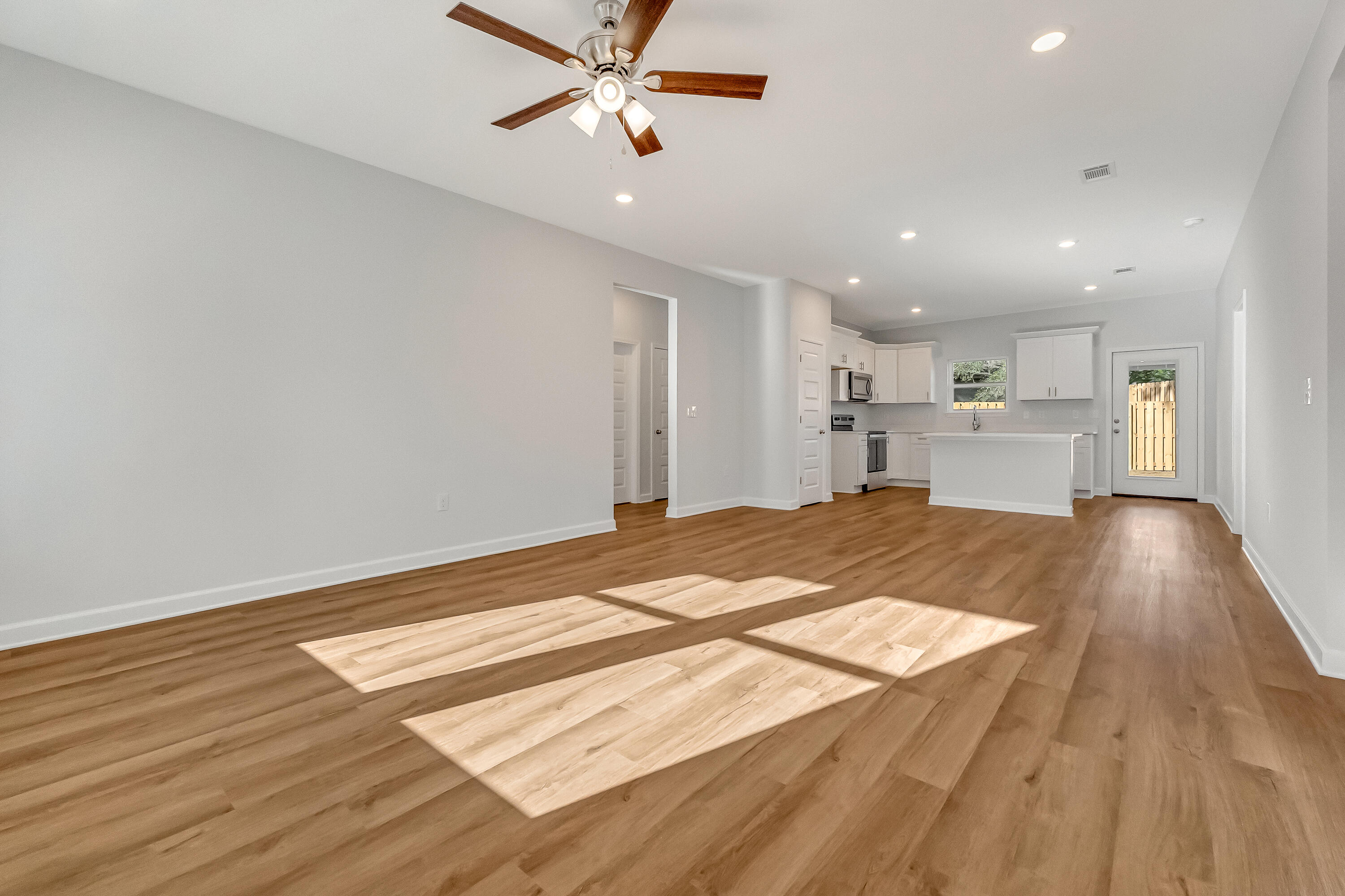 47 Shebbi Lane Freeport, FL 32439 - Photo 3 of 24 a view of a kitchen with a sink and wooden floor