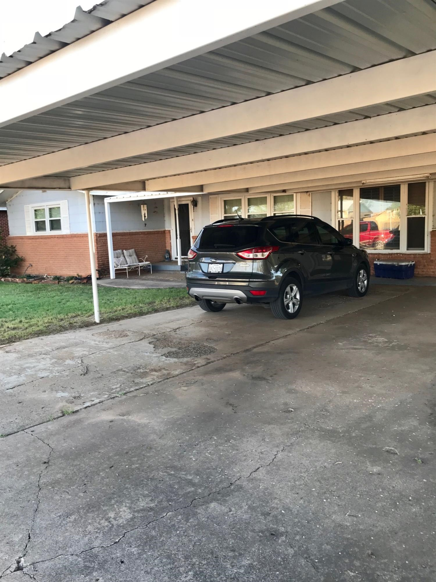 1107 Ave M Ralls, TX 79357 - Photo 2 of 11 a view of garage with a car parked in it