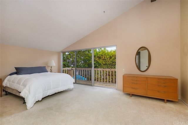 a bedroom with a bed and a walk in closet