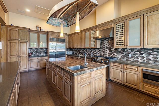 a park view with a bench and lawn chairs