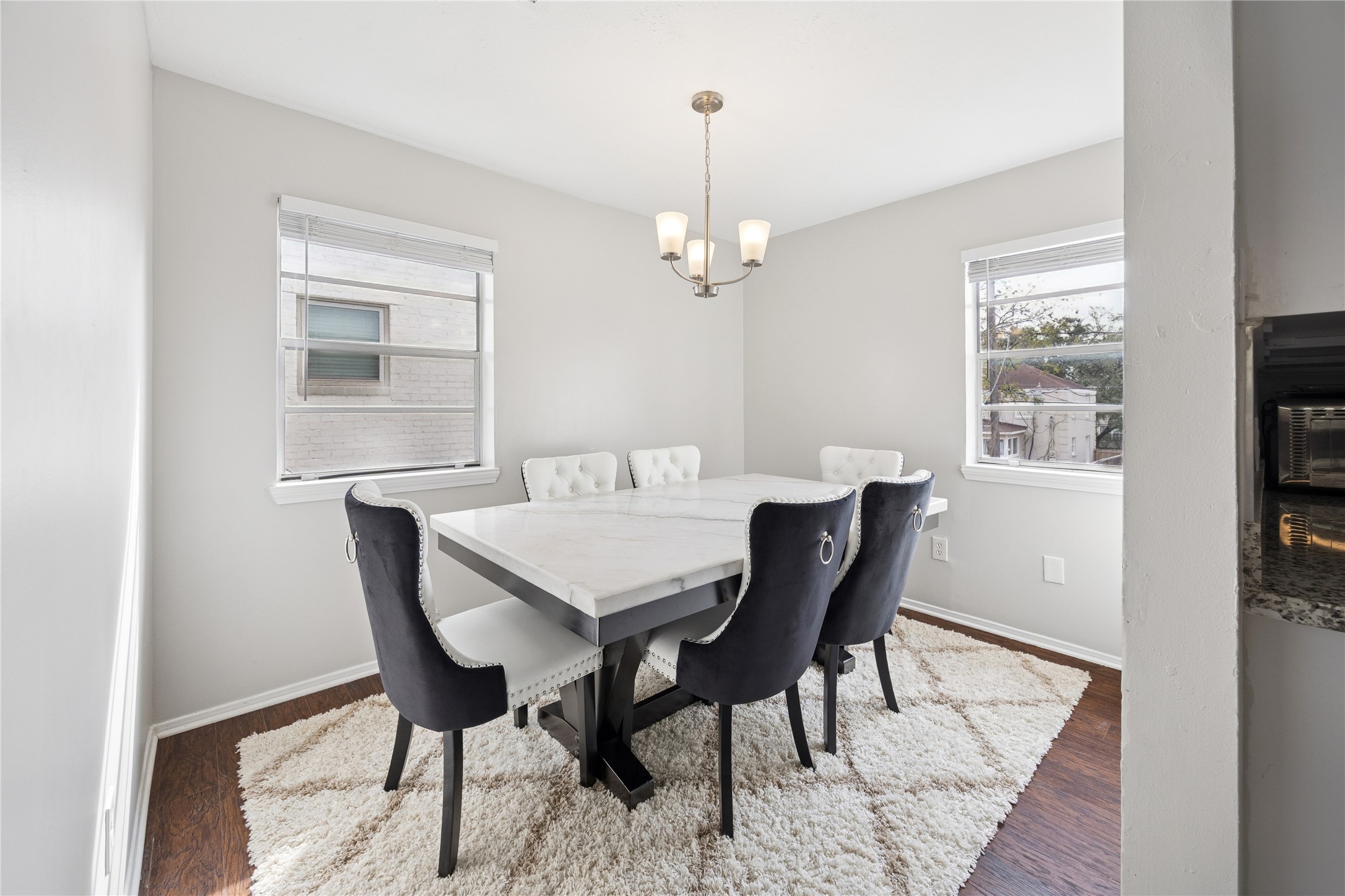 2614 Cleburne Street Houston, TX 77004 - Photo 10 of 22 This bright, versatile dining area easily pivots from a formal setting to a sophisticated home office, secondary lounge, or inspiring creative atelier.