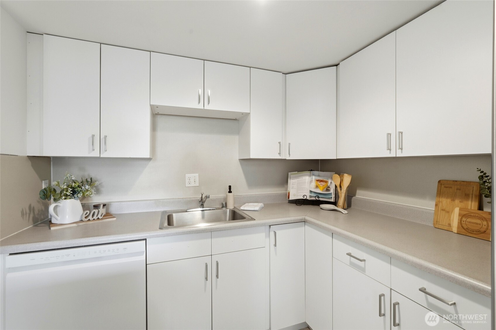 2531 South 248th Street, Unit A18 Kent, WA 98032 - Photo 13 of 28 a kitchen with stainless steel appliances white cabinets and a sink