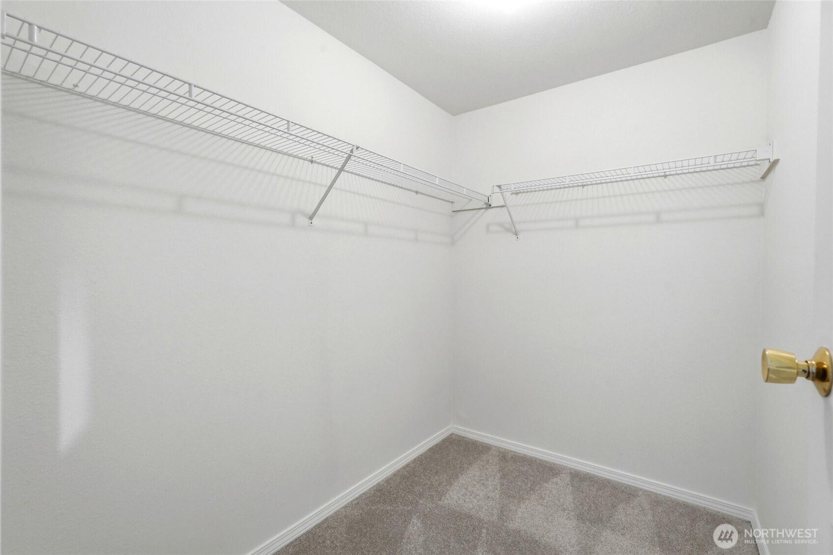 2531 South 248th Street, Unit A18 Kent, WA 98032 - Photo 18 of 28 a view of a room with racks on the wall