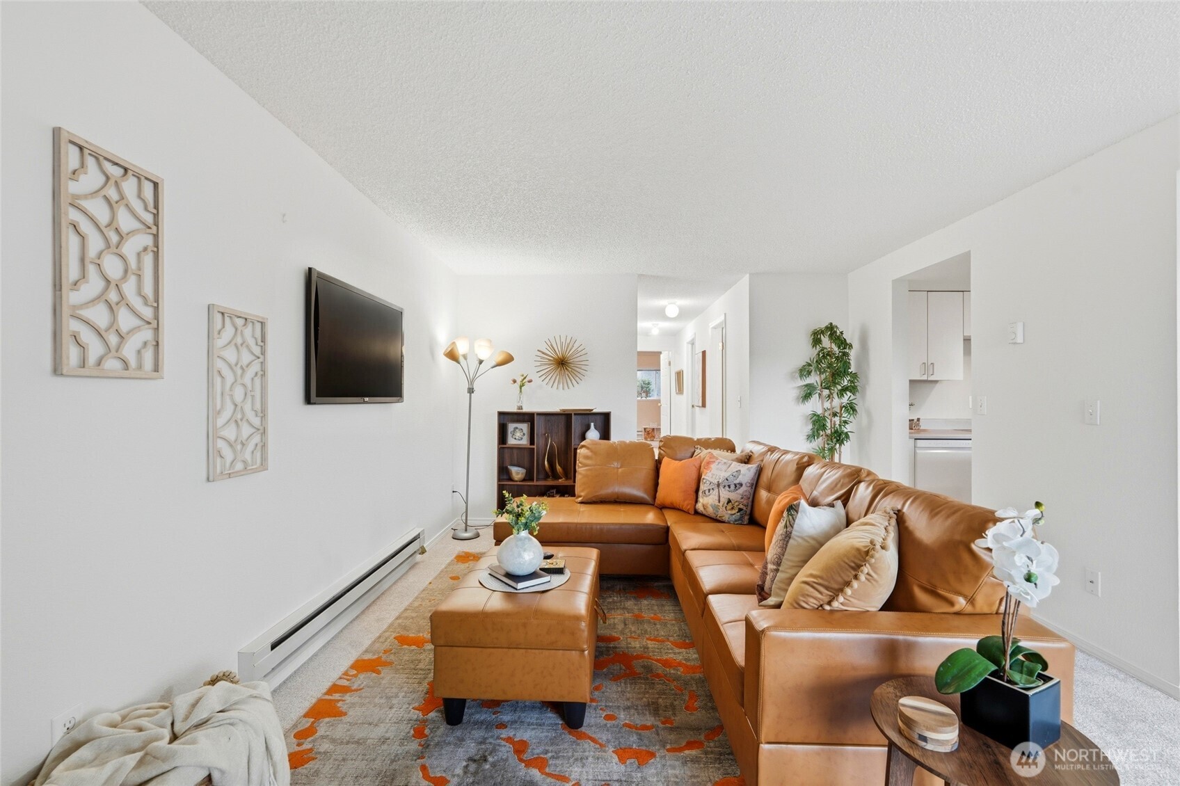 2531 South 248th Street, Unit A18 Kent, WA 98032 - Photo 6 of 28 a living room with furniture and a flat screen tv