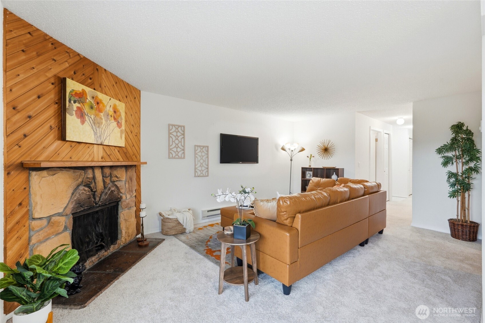 2531 South 248th Street, Unit A18 Kent, WA 98032 - Photo 7 of 28 a living room with furniture and a flat screen tv