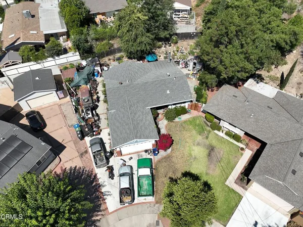 an aerial view of a house with outdoor space