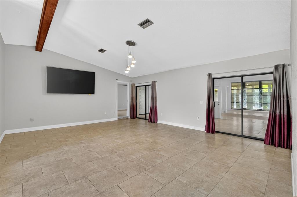 3025 Whitewood Avenue Spring Hill, FL 34609 - Photo 17 of 53 a view of an empty room with a window