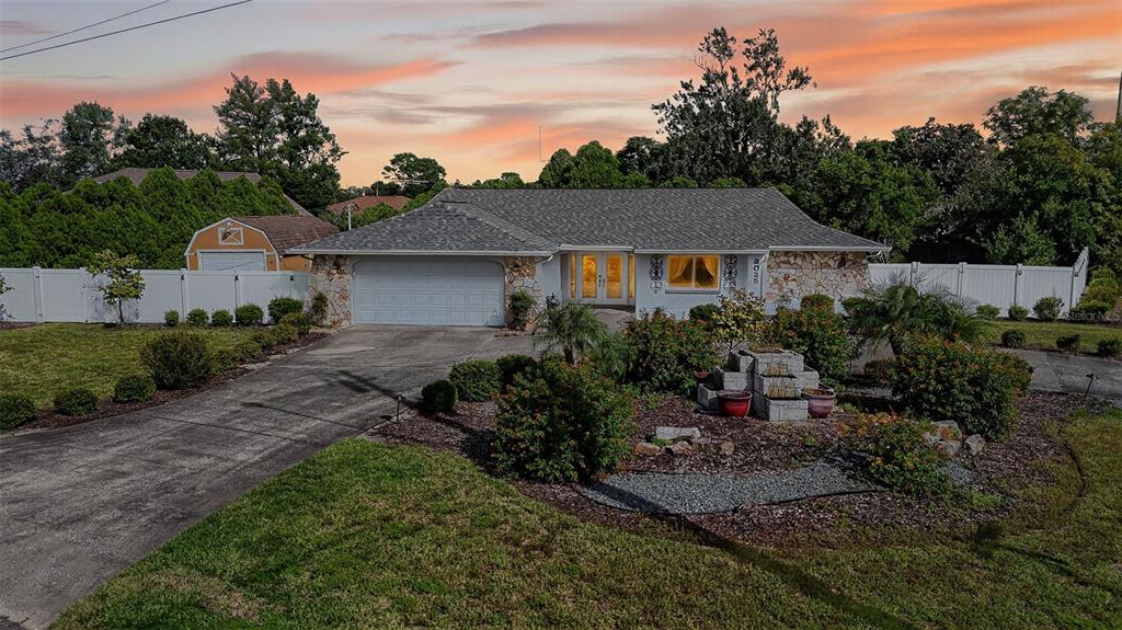 3025 Whitewood Avenue Spring Hill, FL 34609 - Photo 2 of 53 a view of backyard of house with green space