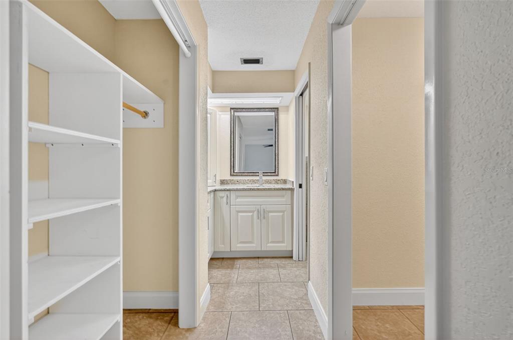 3025 Whitewood Avenue Spring Hill, FL 34609 - Photo 23 of 53 a view of a hallway with a wooden cabinets