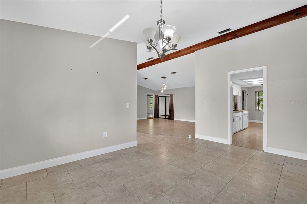 3025 Whitewood Avenue Spring Hill, FL 34609 - Photo 27 of 53 wooden floor in an empty room with a window