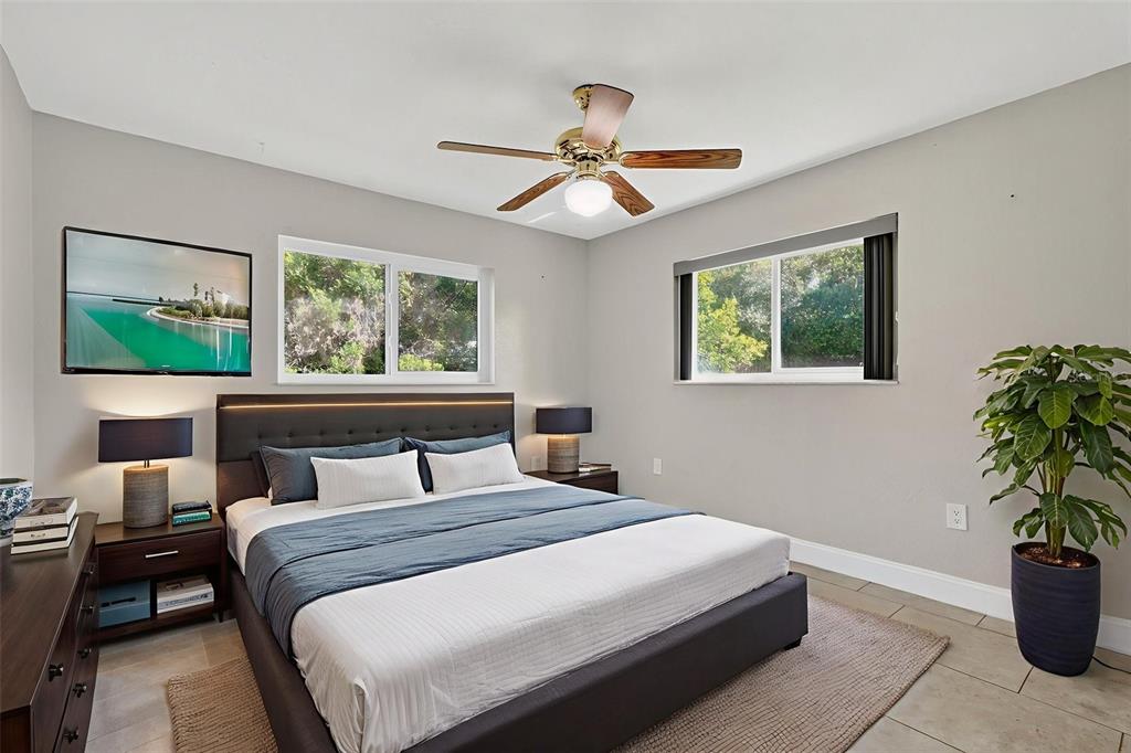 3025 Whitewood Avenue Spring Hill, FL 34609 - Photo 33 of 53 a bedroom with a large bed and a window