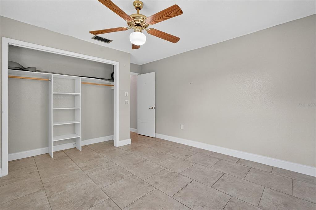 3025 Whitewood Avenue Spring Hill, FL 34609 - Photo 34 of 53 an empty room with closet and fan