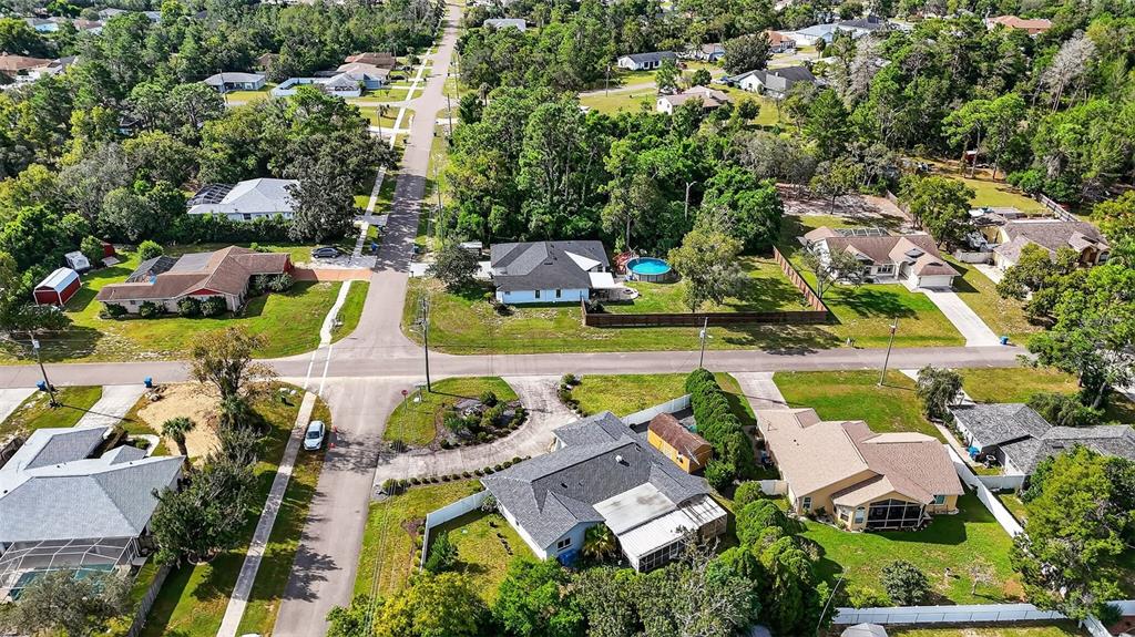3025 Whitewood Avenue Spring Hill, FL 34609 - Photo 4 of 53 an aerial view of residential houses with outdoor space and swimming pool