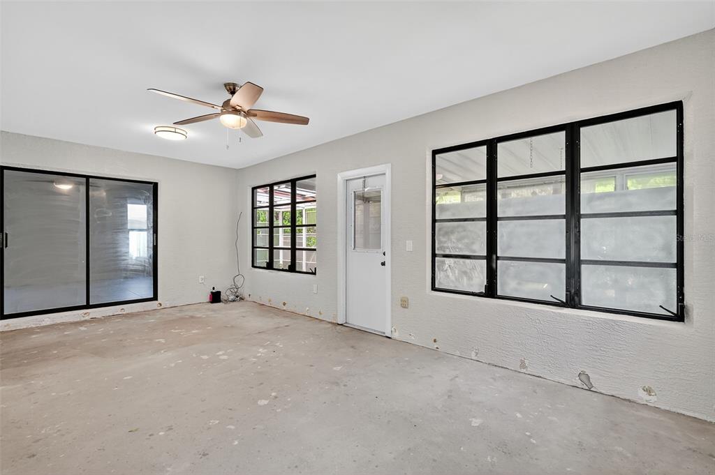 3025 Whitewood Avenue Spring Hill, FL 34609 - Photo 41 of 53 an empty room with windows and fan