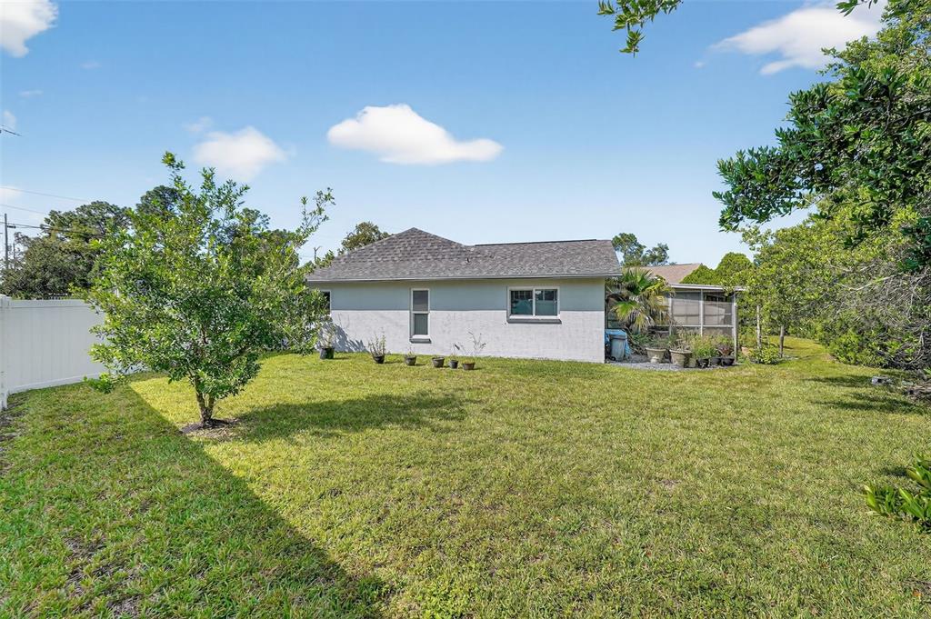 3025 Whitewood Avenue Spring Hill, FL 34609 - Photo 47 of 53 a view of a house with a backyard