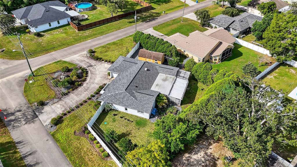 3025 Whitewood Avenue Spring Hill, FL 34609 - Photo 5 of 53 an aerial view of a house with a garden and swimming pool