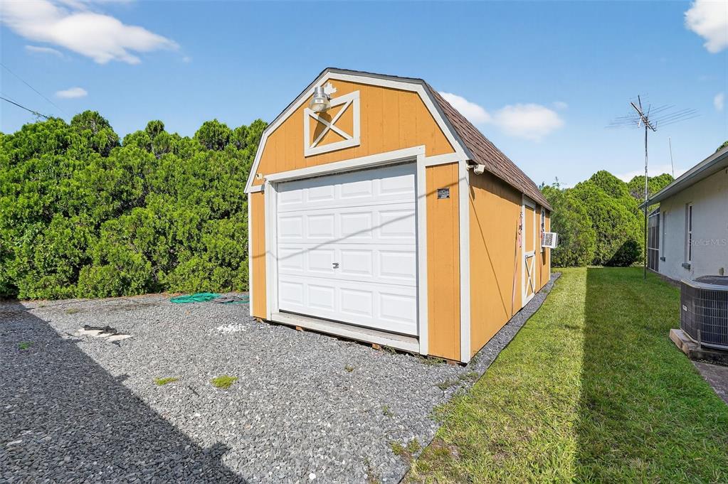 3025 Whitewood Avenue Spring Hill, FL 34609 - Photo 51 of 53 a view of a house with a backyard