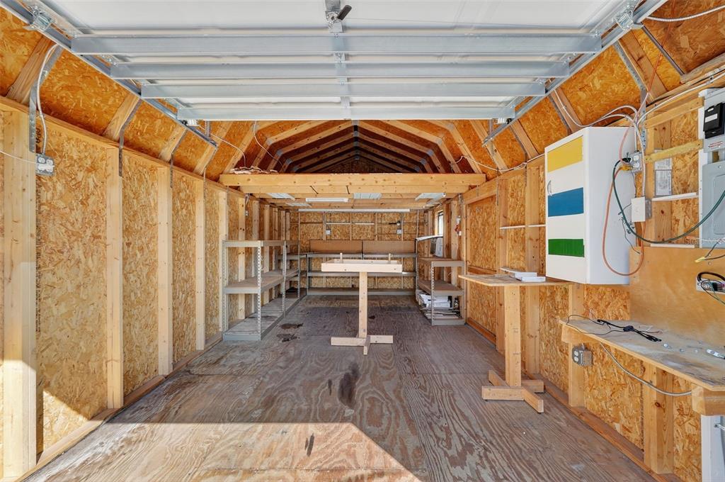 3025 Whitewood Avenue Spring Hill, FL 34609 - Photo 53 of 53 a view of a patio with table and chairs