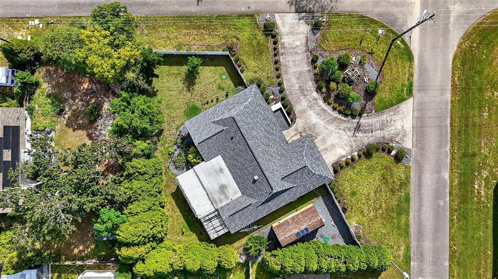 3025 Whitewood Avenue Spring Hill, FL 34609 - Photo 7 of 53 an aerial view of a house with garden space and street view