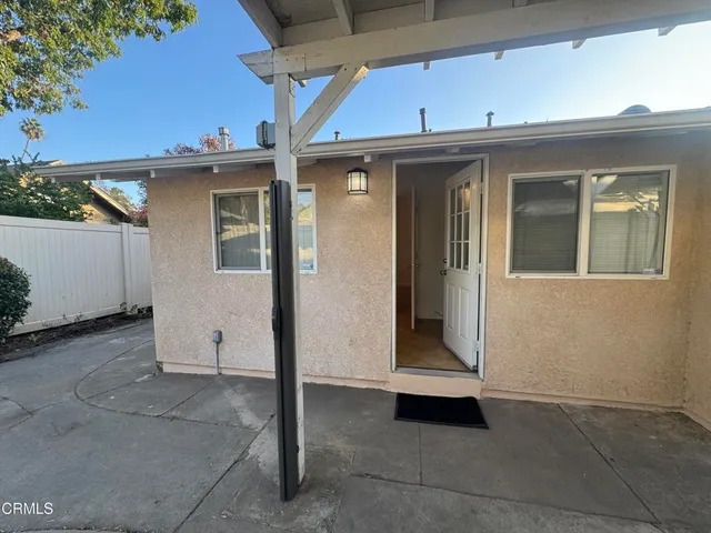 a view of a street with a tree