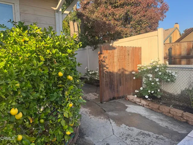 a view of balcony with furniture and garden