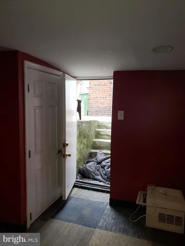 a view of a room that has a bed and a window