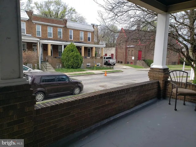 a swimming pool with outdoor seating and yard