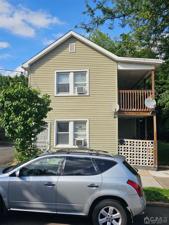 a front view of a house with parking space