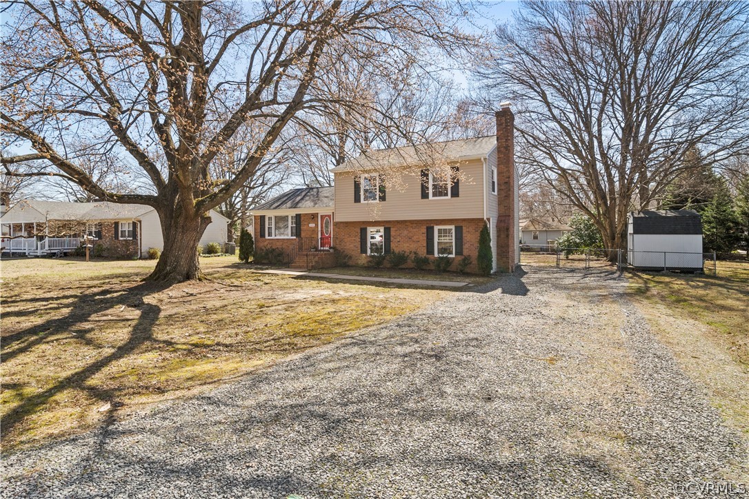 505 Bermuda Hundred Road Chester, VA 23836 - Photo 3 of 45 a front view of a house with a yard covered in snow