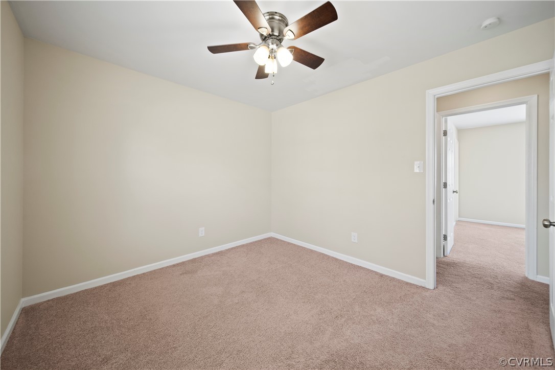 505 Bermuda Hundred Road Chester, VA 23836 - Photo 35 of 45 an empty room with chandelier fan